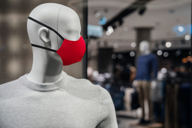 Stylish white mannequin male in a sweater on the background of t